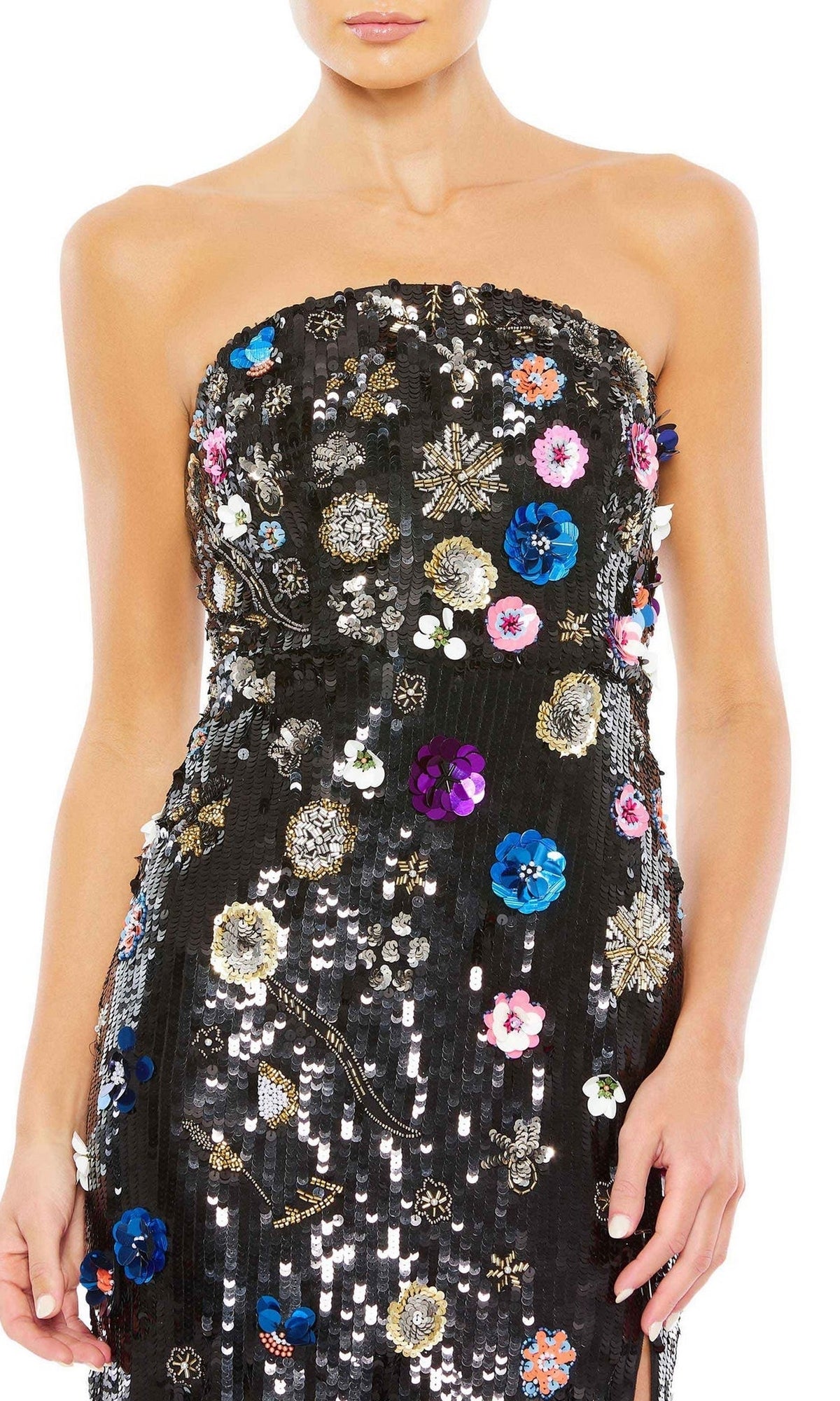 A woman modeling the Long Formal Dress 93695 by Mac Duggal, a strapless black gown featuring sequins and colorful floral embellishments, shown from shoulders to mid-thigh.